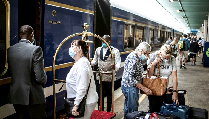 Passengers disembark the Blue Train as it reaches its destination in Pretoria. AFP