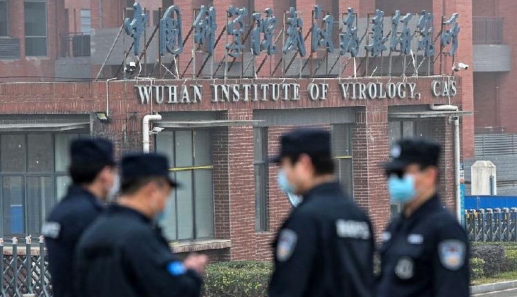 Security personnel stand guard outside the Wuhan Institute of Virology. AFP