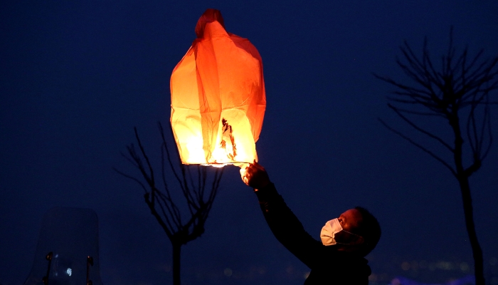 An Iranian releases a lantern during the Wednesday Fire feast in Tehran. AFP