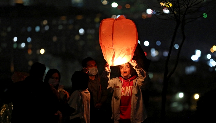 Iranians release a lantern during the Wednesday Fire feast in Tehran. AFP