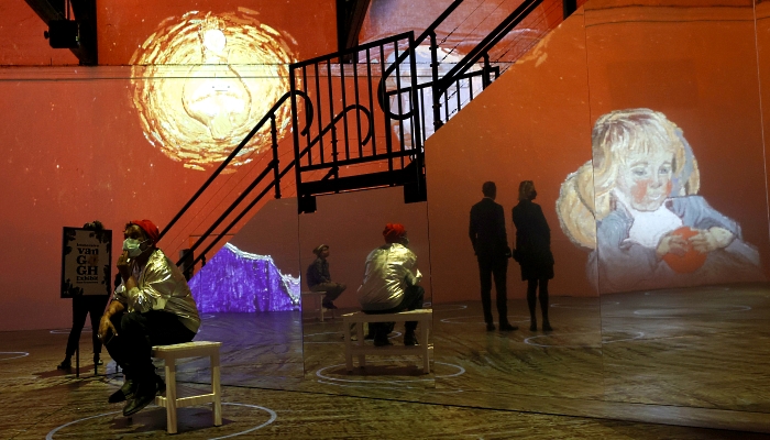 Guests view the Immersive Van Gogh exhibit during a media preview at SVN West in San Francisco, California. AFP