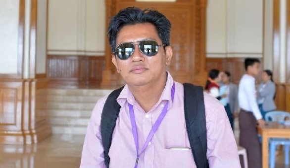 File photo showing BBC News journalist Aung Thura posing for a photo during his coverage of a Myanmar Parliament meeting in Naypyidaw. AFP