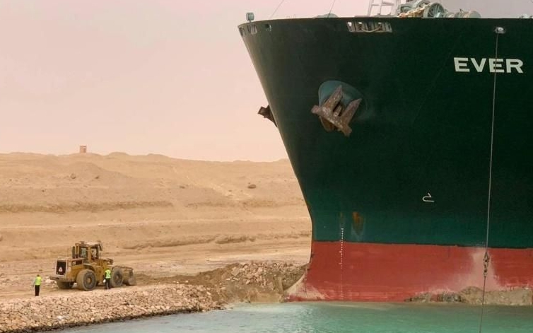 A handout picture released by the Suez Canal Authority shows a part of the Taiwan-owned MV Ever Given (Evergreen), lodged sideways and impeding all traffic on Egypt's Suez Canal. AFP