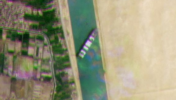 A satellite image released by Planet Labs Inc shows the Taiwan-owned container ship MV Ever Given blocking all traffic through the main channel of the Suez Canal. AFP