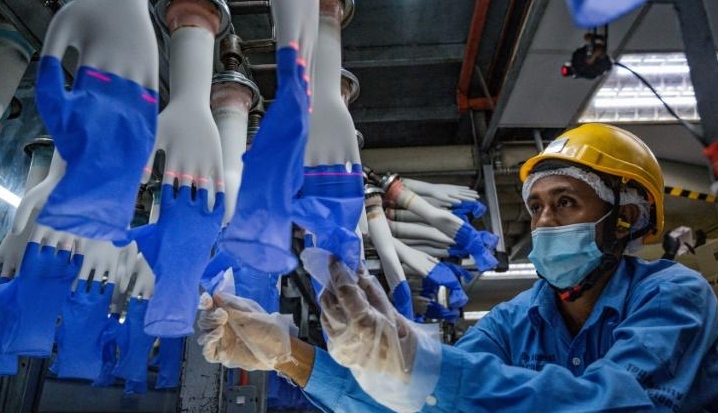 The US has imposed a ban on Malaysian glove maker Top Glove after concluding the company uses forced labor. AFP