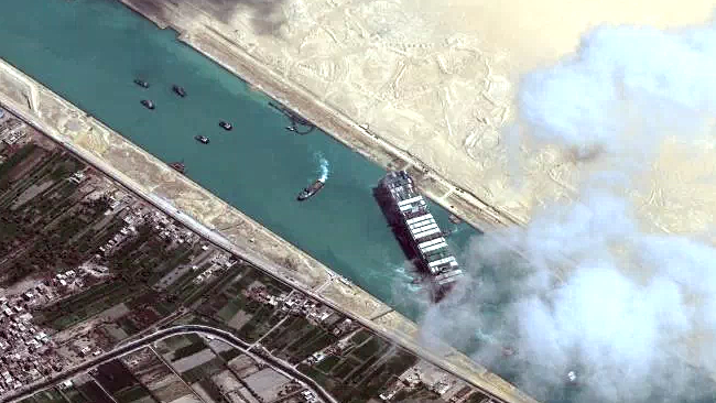 This satellite image released by Maxar Technologies shows the MV Ever Given container ship and tugboats in the Suez Canal. AFP