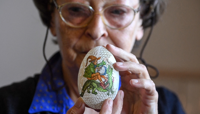 Tunde Csuhaj, creator of artfully decorated Easter eggs, presents a goose egg at her workroom in the town of Szekszard, Hungary. AFP