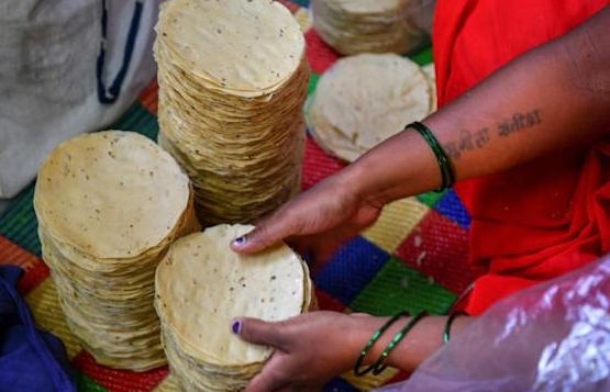 Lijjat's commitment to women's empowerment reflects its beginnings, when seven housewives gathered on a Mumbai rooftop one morning to prepare papads. AFP