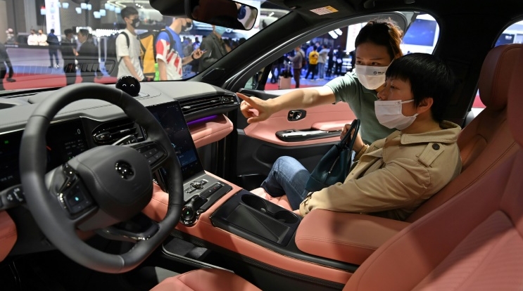 The electric vehicle sector has seen a stampede of tech giants, including major Chinese firms. AFP