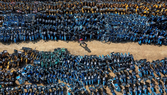 Aerial photo showing abandoned public shared bicycles at a lot in Shenyang in China's northeastern Liaoning province. AFP