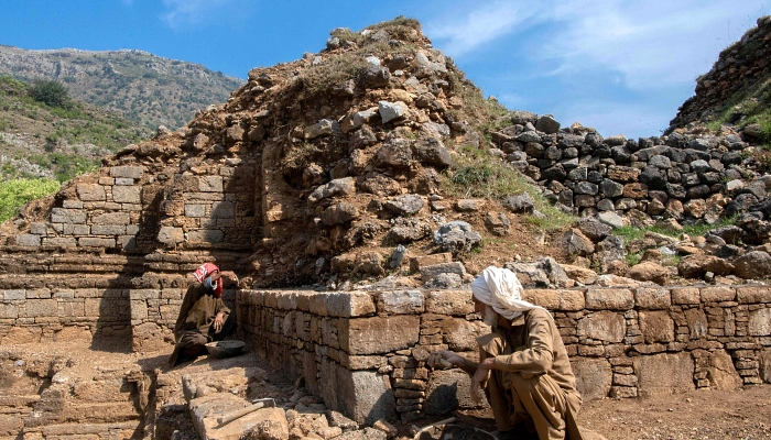 Conservators work at Bhamala Stupa, a ruined Buddhist stupa and National Heritage Site near Haripur in Khyber Pakhtunkhwa province, Pakistan. AFP