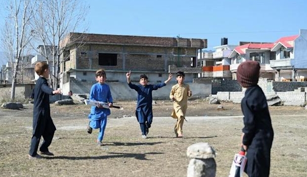 Children play cricket at the site Osama bin Laden's demolished former compound. AFP