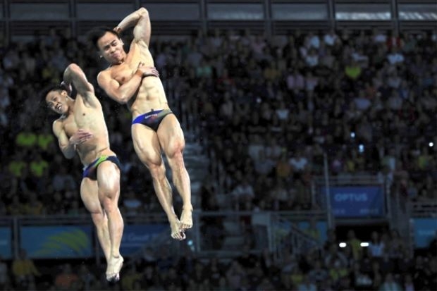 黄兹梁与周贻尉（右）这对老搭档，放眼能在东京世界杯男双3公尺跳板赛抢下东京奥运会资格。（美联社档案照）

