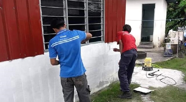 Zeng is happy to help others, including painting a house.