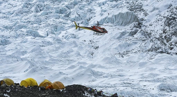 A helicopter flies over the Everest base camp in the Mount Everest region of Solukhumbu district 140km from Kathmandu. AFP