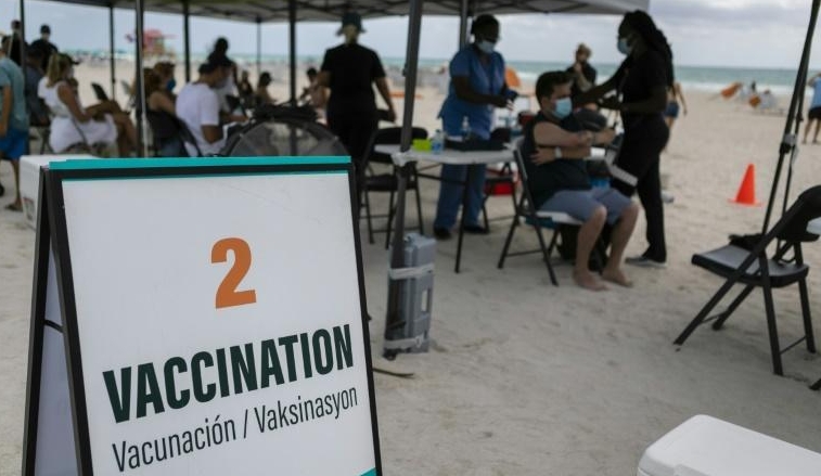 People get a Johnson & Johnson Covid-19 vaccine at a pop-up vaccination center at the beach, in South Beach, Florida. AFP People get a Johnson & Johnson Covid-19 vaccine at a pop-up vaccination center at the beach, in South Beach, Florida. AFP