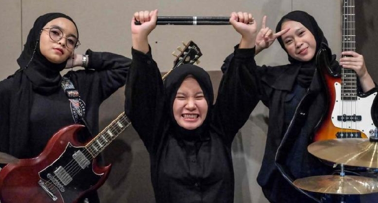 Members of Voice of Baceprot: Firda Marsya Kurnia, Euis Siti Aisah, and bassist Widi Rahmawati. AFP