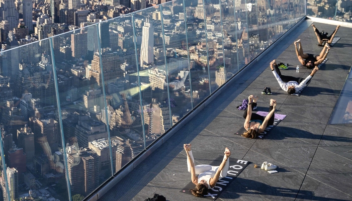 Yoga practitioners attend a class on the Edge Observation Deck, billed as the highest outdoor sky deck in the Western Hemisphere at 345 meters, overlooking the Manhattan skyline in New York City. AFP