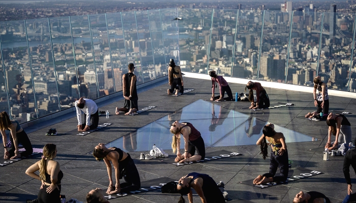 Yoga practitioners attend a class on the Edge Observation Deck, billed as the highest outdoor sky deck in the Western Hemisphere at 345 meters, overlooking the Manhattan skyline in New York City. AFP