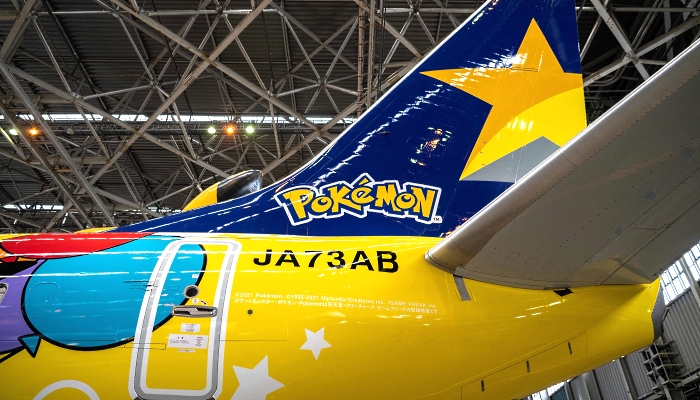 A Skymark Airlines Boeing 737-800 aircraft with its new Pokemon-themed livery in a hangar at Tokyo's Haneda International Airport during its unveiling on Monday. AFP