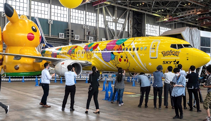 A Skymark Airlines Boeing 737-800 aircraft with its new Pokemon-themed livery in a hangar at Tokyo's Haneda International Airport during its unveiling on Monday. AFP