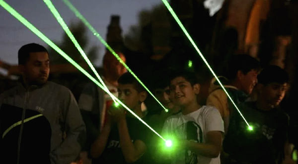 Lasers are directed towards the windows of homes in the settlement. AFP