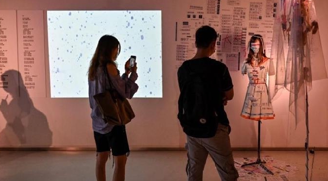 People visiting an anti body-shaming exhibition at the Himalaya Museum in Shanghai. AFP