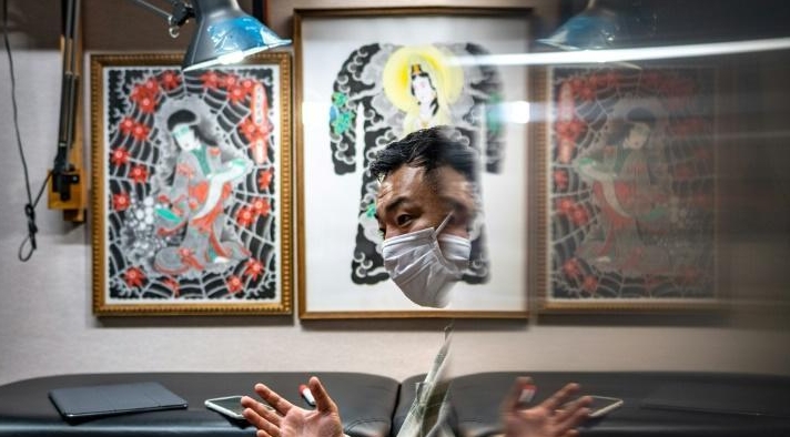 Ichi Hatano is now offering his Japanese folk tattoos as digital artworks protected by blockchain technology. AFP