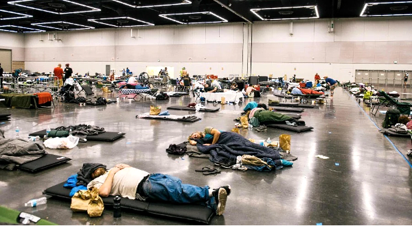 People rest at the Oregon Convention Center cooling station in Portland. AFP People rest at the Oregon Convention Center cooling station in Portland. AFP