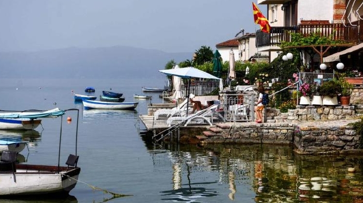 Local residents sunbathe on the shore of Lake Ohrid. AFP