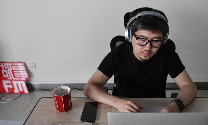 Kou Aizhe, the 38-year-old creator of StoryFM, a podcast featuring first-person narrations from all walks of life. AFP
