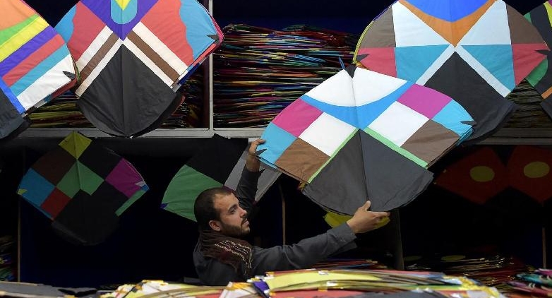 A kite vendor displays his merchandise for sale at a shop in Shor Bazaar in the old quarters of Kabul. AFP
