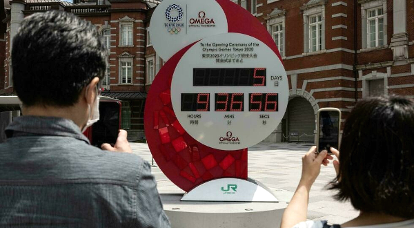 The Tokyo Olympic countdown clock shows five days to go before the opening ceremony. AFP