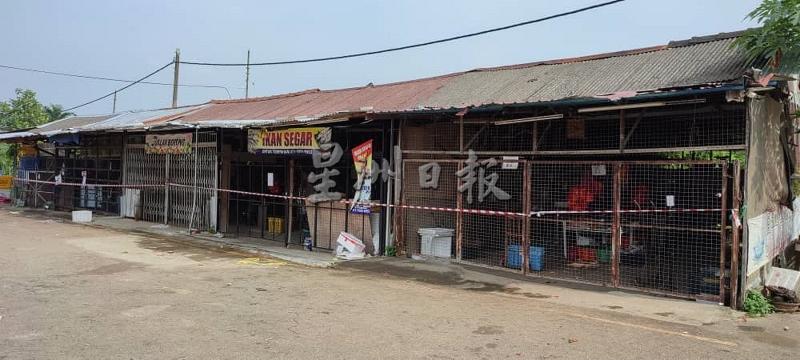 马口公市主要建筑物一侧的木板批发单位，也是被封锁的范围，这里的贩商已完成筛检。