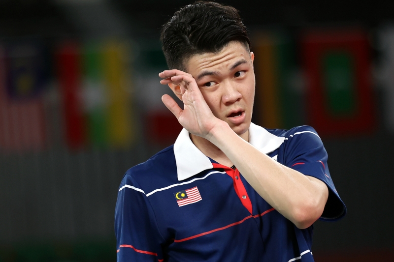 李梓嘉在东京奥运会羽球男单16强被淘汰，未能带回一枚奖牌，向所有马来西亚人道歉。（马新社照片）