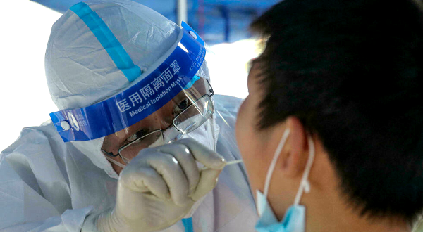 China has confined the residents of entire cities to their homes and rolled out mass testing as it battles its largest coronavirus outbreak in months. AFP