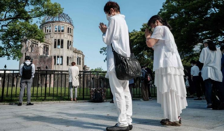 People offering prayers by the Atomic Bomb Dome on the 76th anniversary of the attack on Hiroshima. AFP People offering prayers by the Atomic Bomb Dome on the 76th anniversary of the attack on Hiroshima. AFP