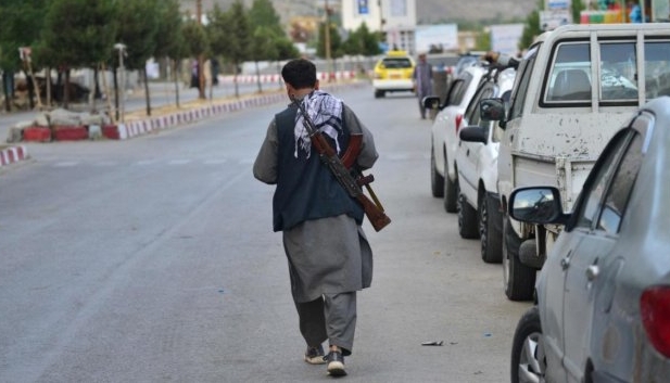 A member of Afghan security force walks through a road in Panjshir province. AFP
