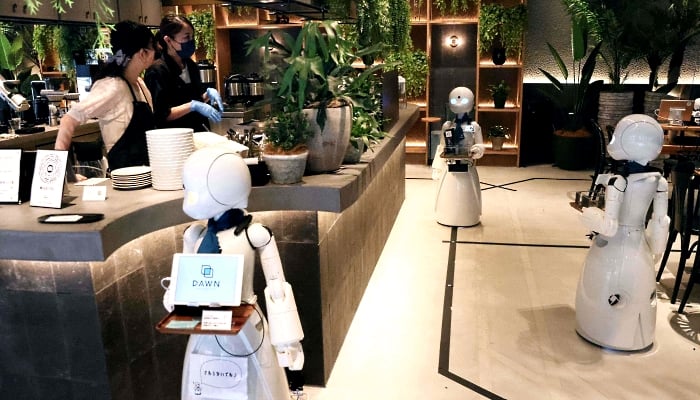 Humanoid robots at the Dawn Cafe in Tokyo. AFP